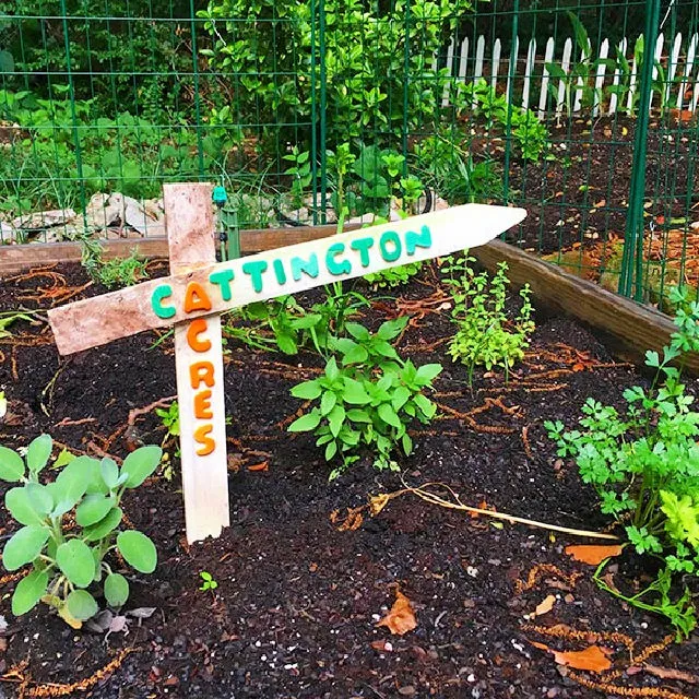 DIY Garden Sign from Reclaimed Wood Fence Stakes